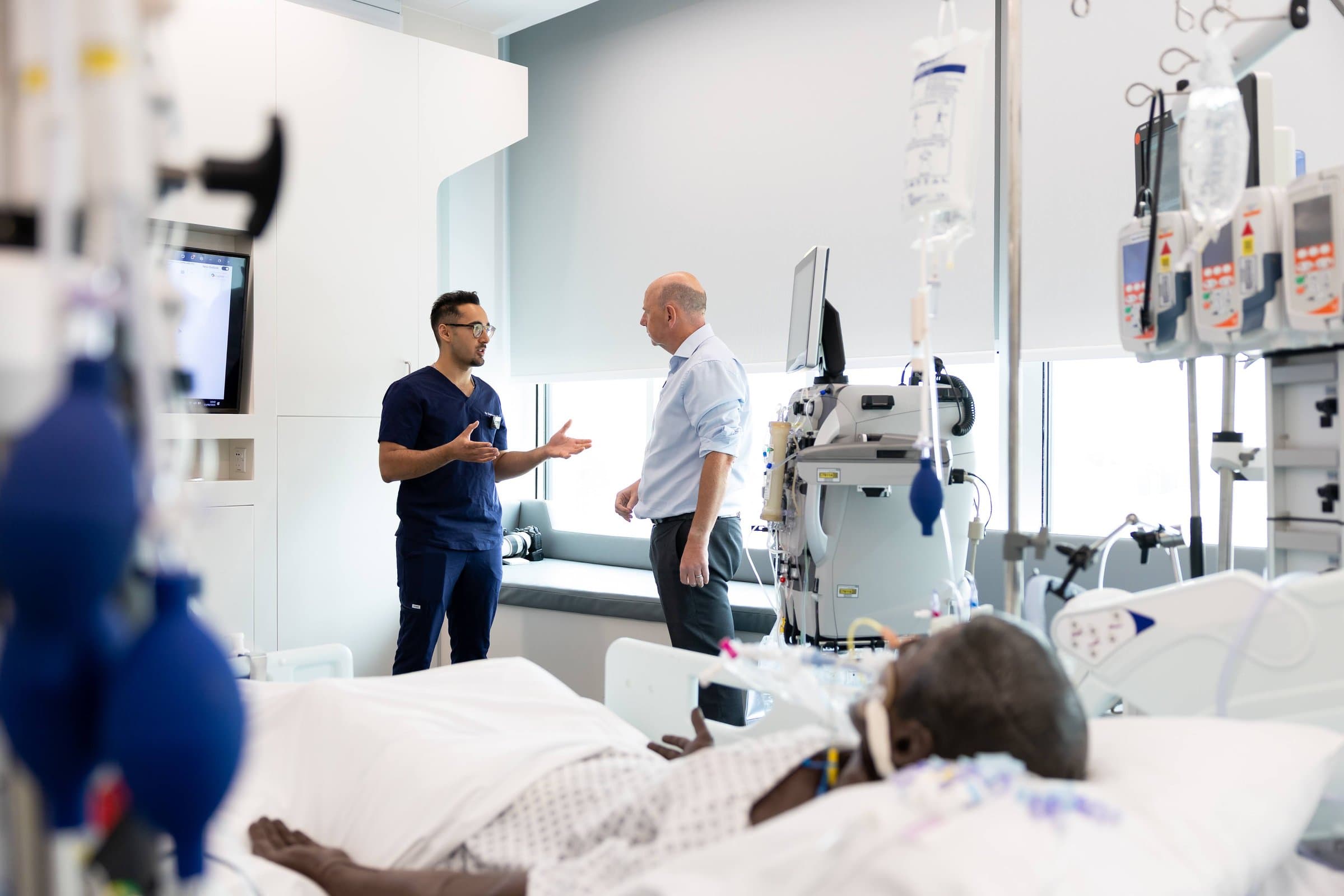 Dr Dev Gakhar on a hospital ward discussing AI equipment with the Secretary of State
