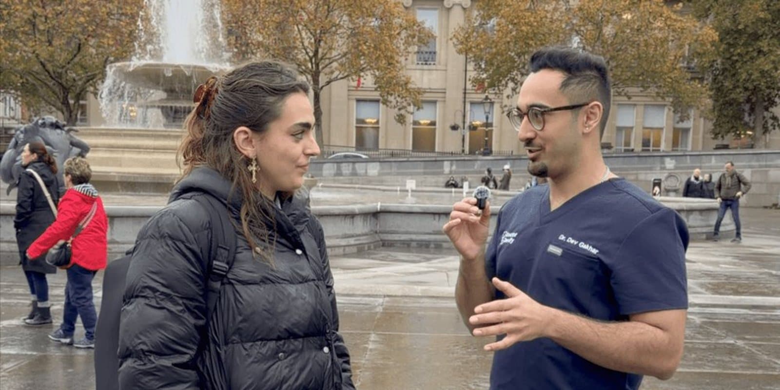 Dr Dev Gakhar interviewing a member of the public in Trafalgar Square